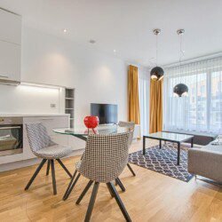 Two Chairs With Glass Table on Living Room Near Window